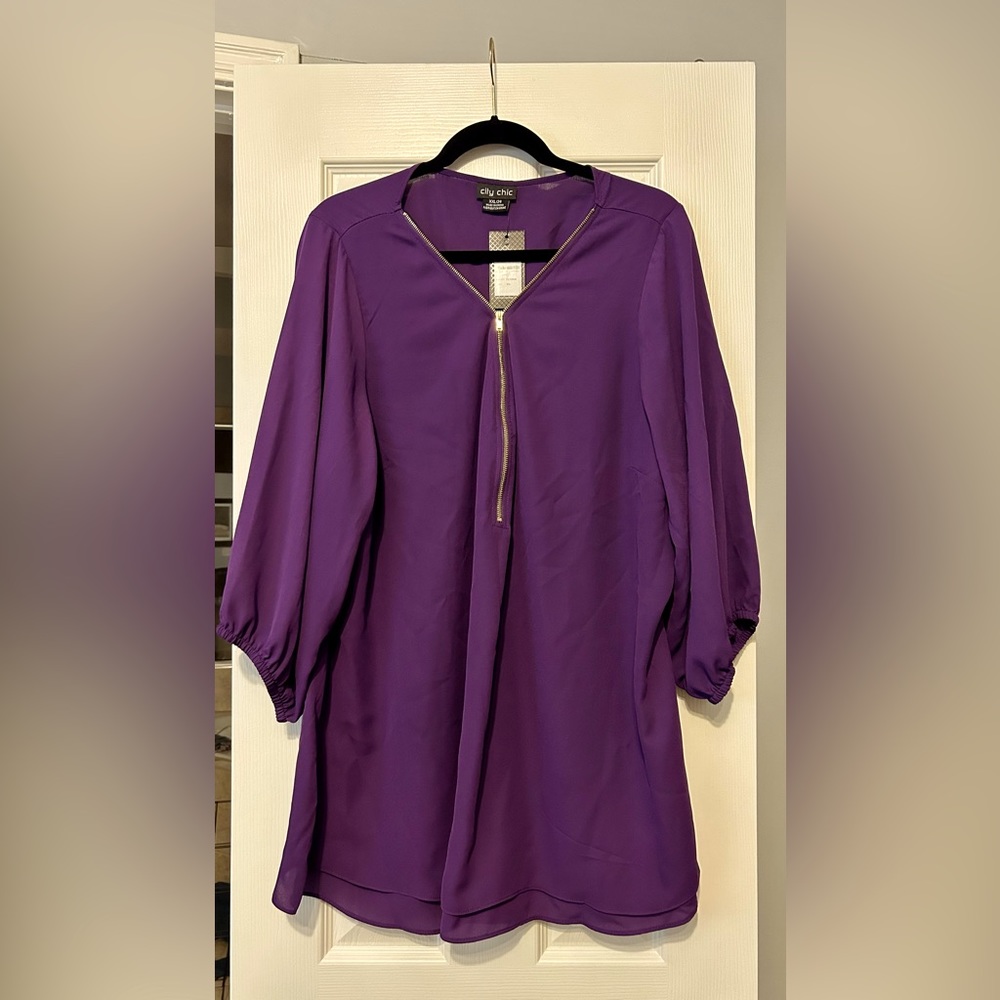 Beautiful purple top with cute gold zipper detail.